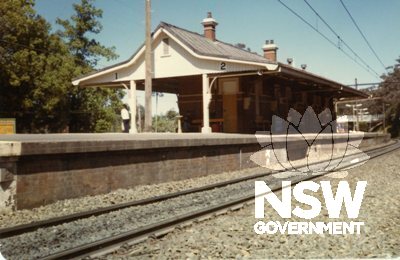 Beecroft Railway Station - Island platform looking south showing opening for signal rodding and wires under platform face  c.1984