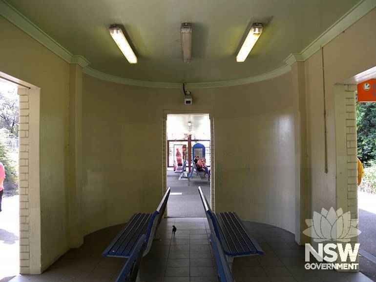 Caringbah Railway Station - interior of  open waiting area  with curved wall - east end of Platform building