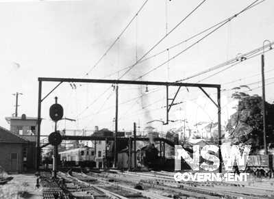 Gosford Railway Station - View from Newcastle end of the platforms. Signal Box at north end of up main (No.1 Platform) on left, Loco servicing area at right.  c.1969