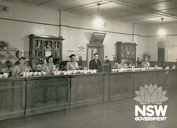 Taree Railway Refreshment Room- interior showing staff behind counter, 1947.