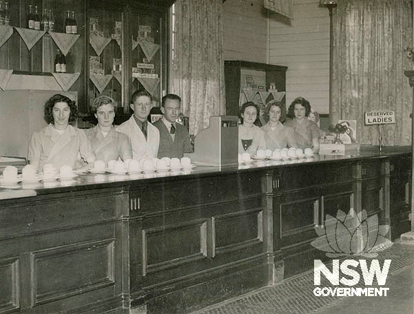 Narrabri Railway Refreshment Room- interior showing staff behind counter, 1951