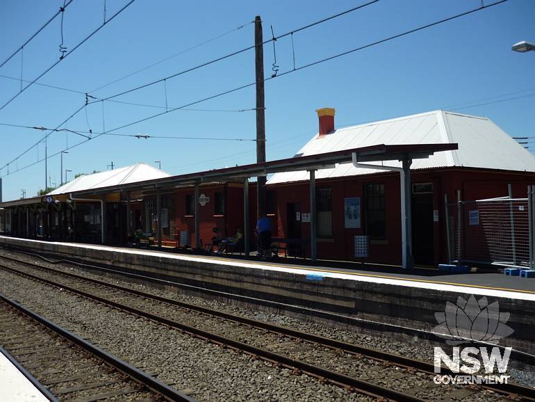 Platfrom 1 station buildings viewed from level crossing over Garfield Road West.