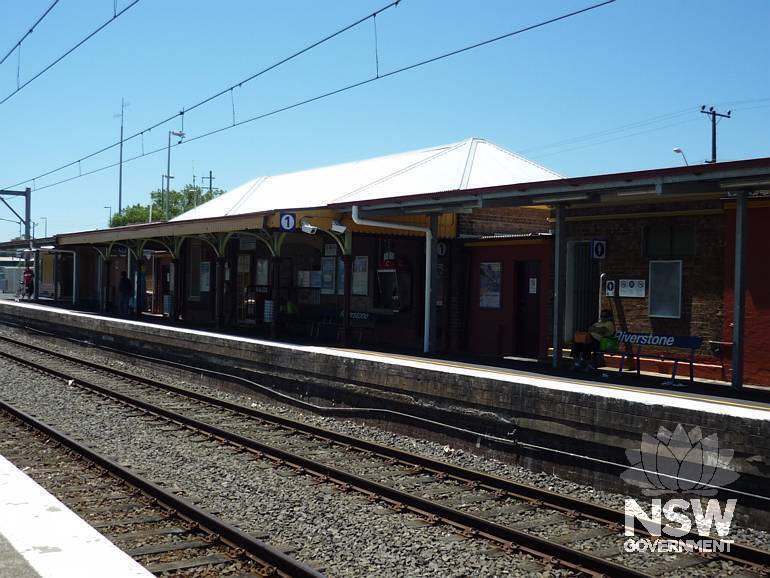 Platfrom 1 station building viewed from level crossing over Garfield Road West.