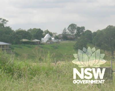 The hill side setting of the church above the flats of the Nepean River