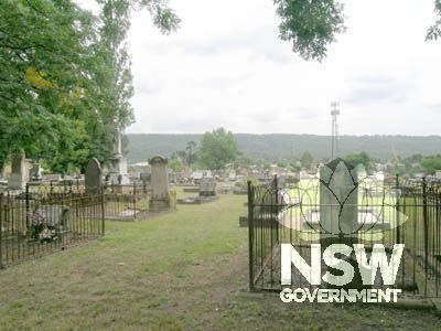 Cemetery monuments against Blue Mountains escarpment