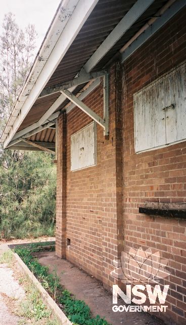 View of explosives storehouse from Dunheved Circuit showing the two shutter window openings and the large roof overhang.