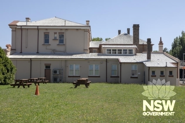 Moss Vale Railway Precinct - Lawn area and buildings between the platforms.