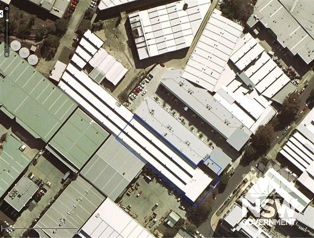 2003 aerial photograph showing the former factory with the current site annotated in blue