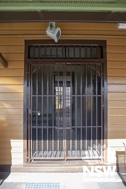 Berala Railway Station Group - Waiting room doorway with security doors.