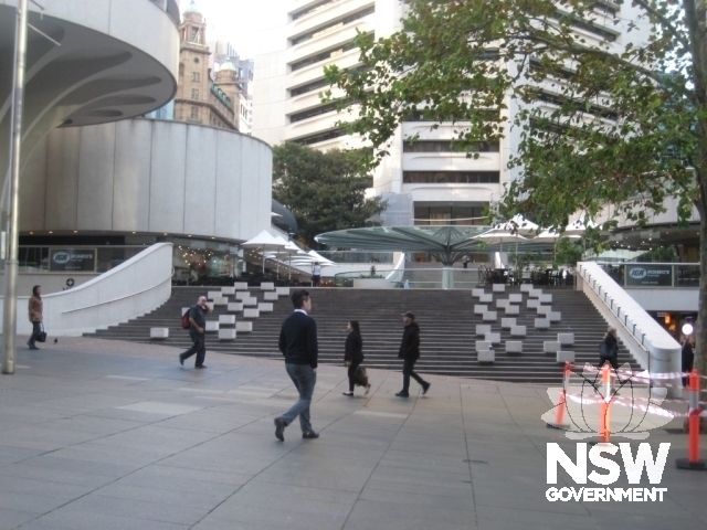 Ramped steps connecting the plaza to Martin Place, with non-original white blocks on steps