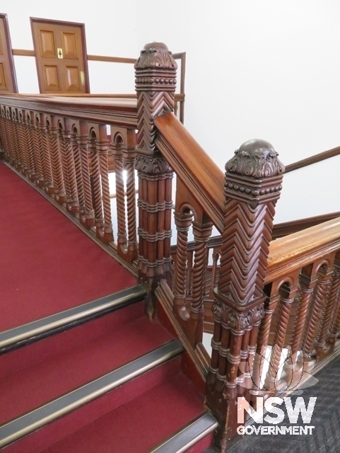 Building A: Newel posts and handrail at top level of the main staircase