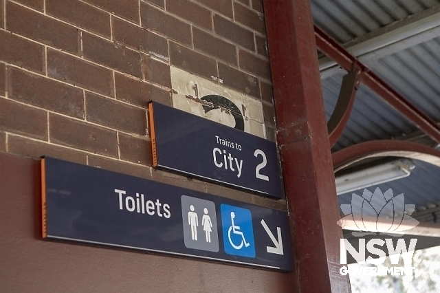 Regents Park Railway Station Group - Station signage new over the old painted platform number 2