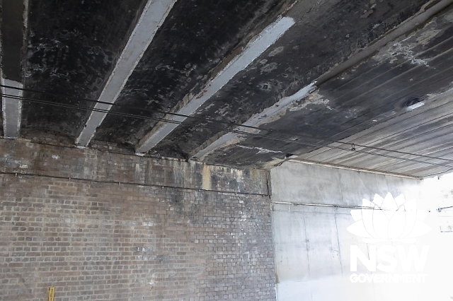 Riverwood Railway Station Group - Arched brickwork and steel girders under overbridge.