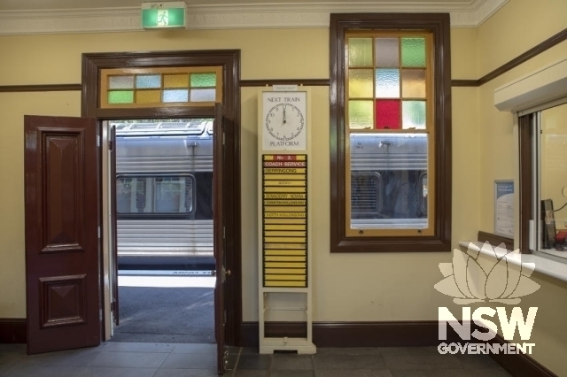 Kiama Railway Station Group - Waiting room with rollover indicator boards and ticket window.