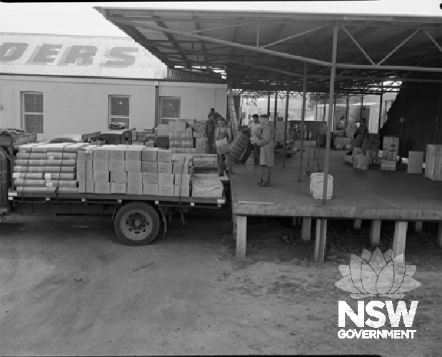 Loading and unloading trucks at Rudders premises, 1960.