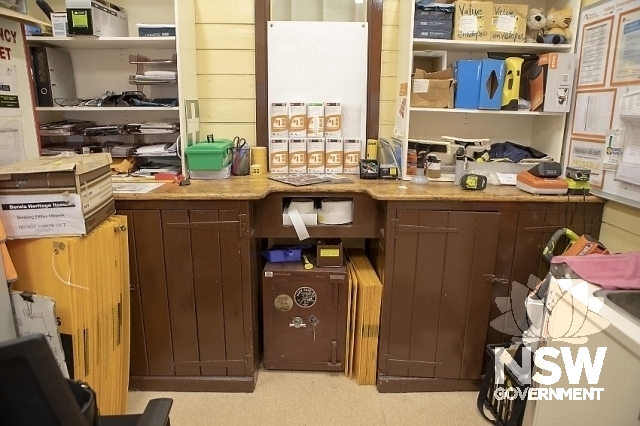 Berala Railway Station Group - Office interior with the past ticket window, benches and safe.