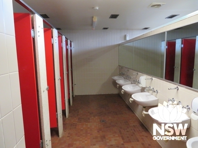 Block T1D: Typical male toilet with original wall & floor tiles & terrazzo toilet partitions