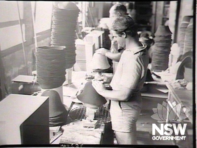 Hat making at this factory in 1949 showing the building windows