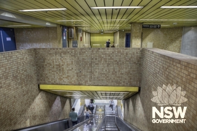 Redfern Railway Station Group - Escalators and yellow Redfern colour scheme