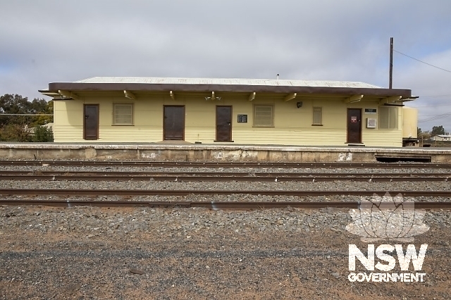 Menindee Railway Station - Station building across the tracks with concrete platform