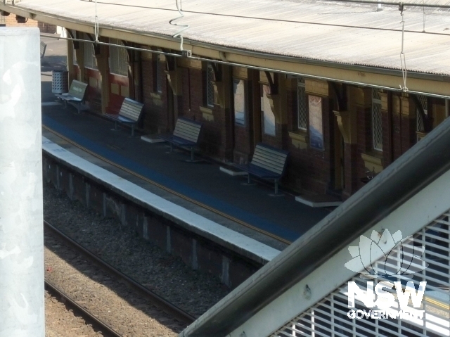 Up platform with Steel rail post and reinforced concrete retaining wall + concrete cantilever coping
