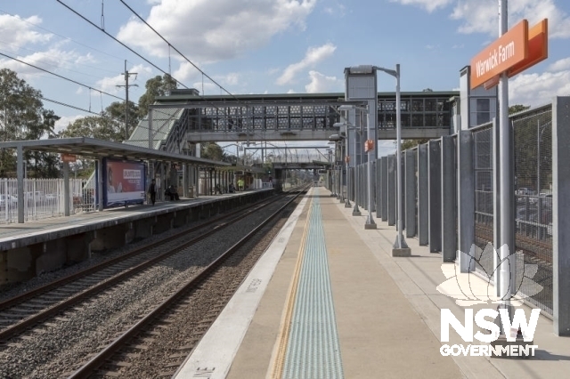Warwick Farm Railway Station Group - Overhead footbridge and lifts over platform.