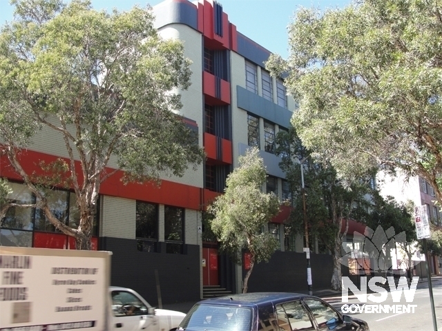 Part of the Elizabeth Street facade and Art Deco decorative details above the front entrance