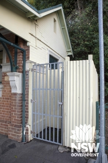 Scarborough Railway Station Group-Platform 1 building North elevation and corrugated fence and gate.