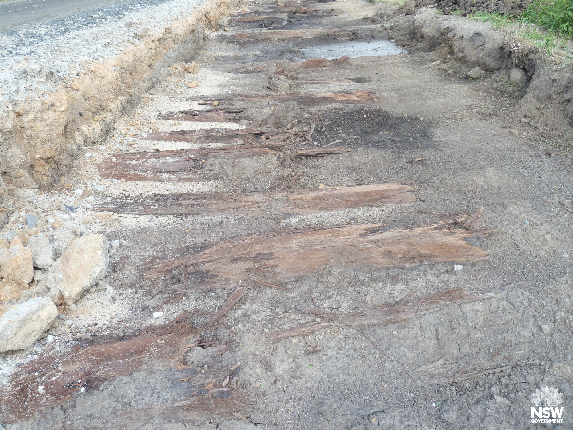 Evidence of an early corduroy road under existing road on approach to Sugar mill to the north of Conservation Area