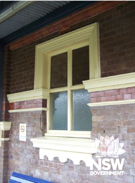 Decorative cement render detailing. The moulding on the wall surfaces is emphasised by bricks with a glazed surface.