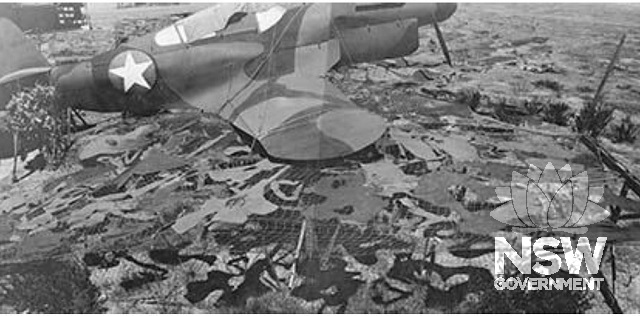 Experimental camouflage where nets were placed immediately beneath the wings of aircraft to eliminate cast shadows National Archives of Australia image no. (Image C1905, 3 [1])
