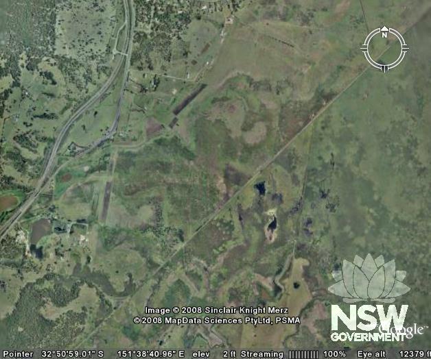 Aerial view of Minmi-Hexham Rail from Google Earth (cont.). Line can be seen continuing diagonally across Hexham Swamps (bisecting compass diagram). [Source: Google Earth]