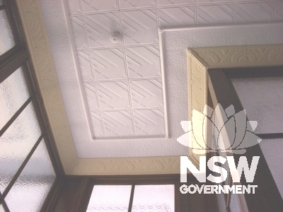 Detail showing decorative pressed metal ceiling and cornices typical of first and second floors in hallway near executive offices first floor