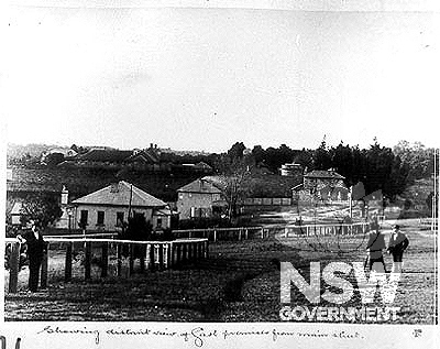 Showing distant view of Gaol premises from main street, c.1898