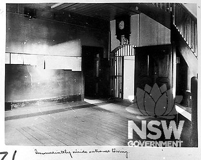 Immediately inside entrance to wing, c.1898