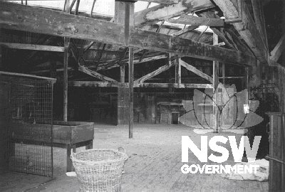The wool sorting area in 2002.  The large space is created with the use of cypress pine trusses supported on massive stone piers, which are clad with dressed cypress to prevent wool catching on them.