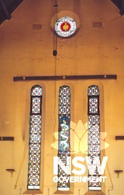 Interior of  All Saints Anglican Church Condobolin - stained glass window group on east wall by Lyon & Cottier.