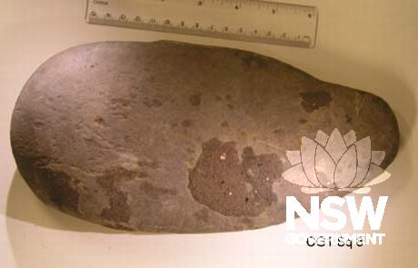 Ground edge axe (265 x 142 x 20mm in size) found during excavation of the Meriton Building Site in 2002. The axe is made from dark, fine-grained metamorphic material called Hornfels. It has two ground surfaces.