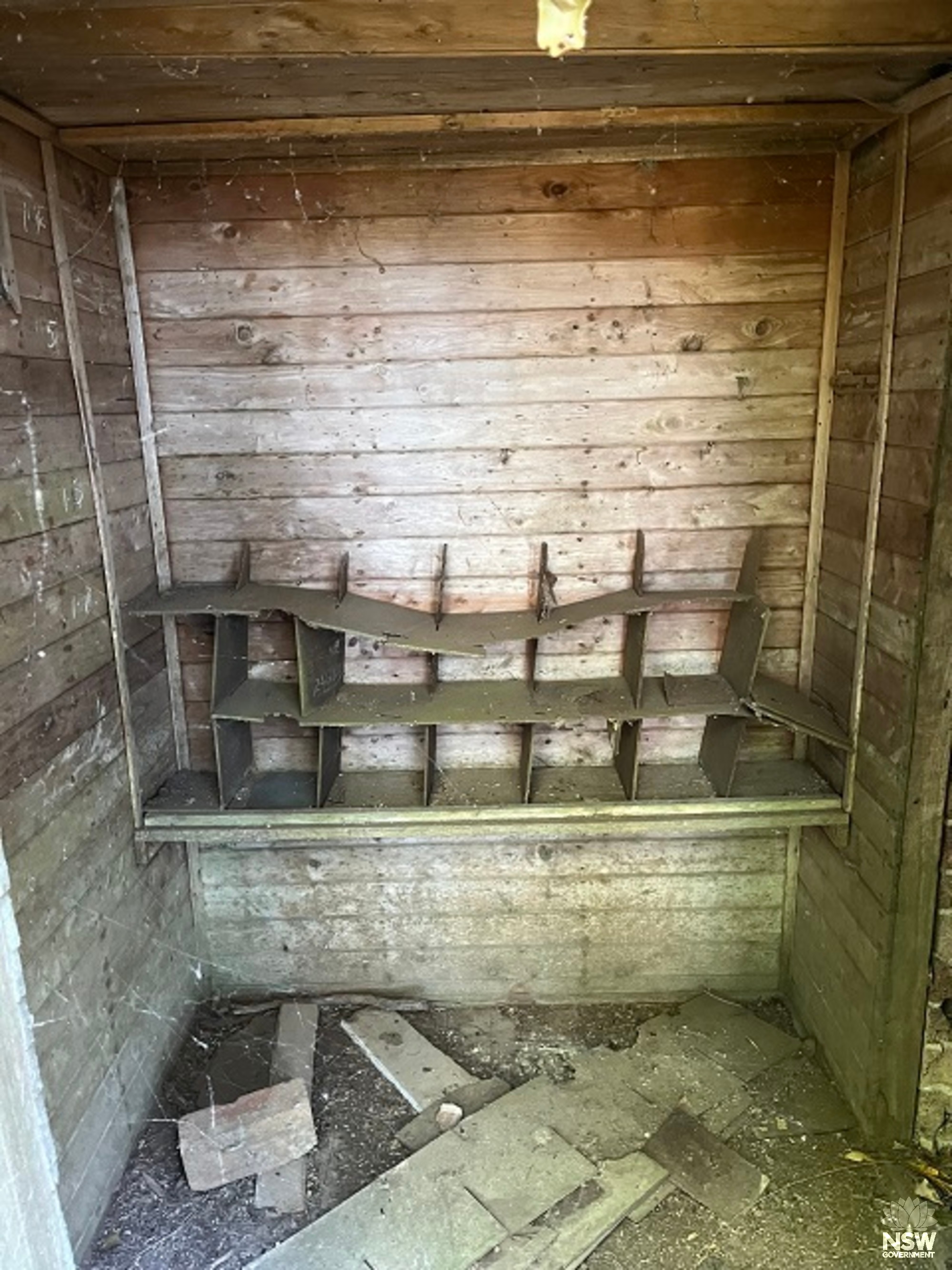 Building 16 - Explosives Magazine - smaller room - timber lining and remnant shelving