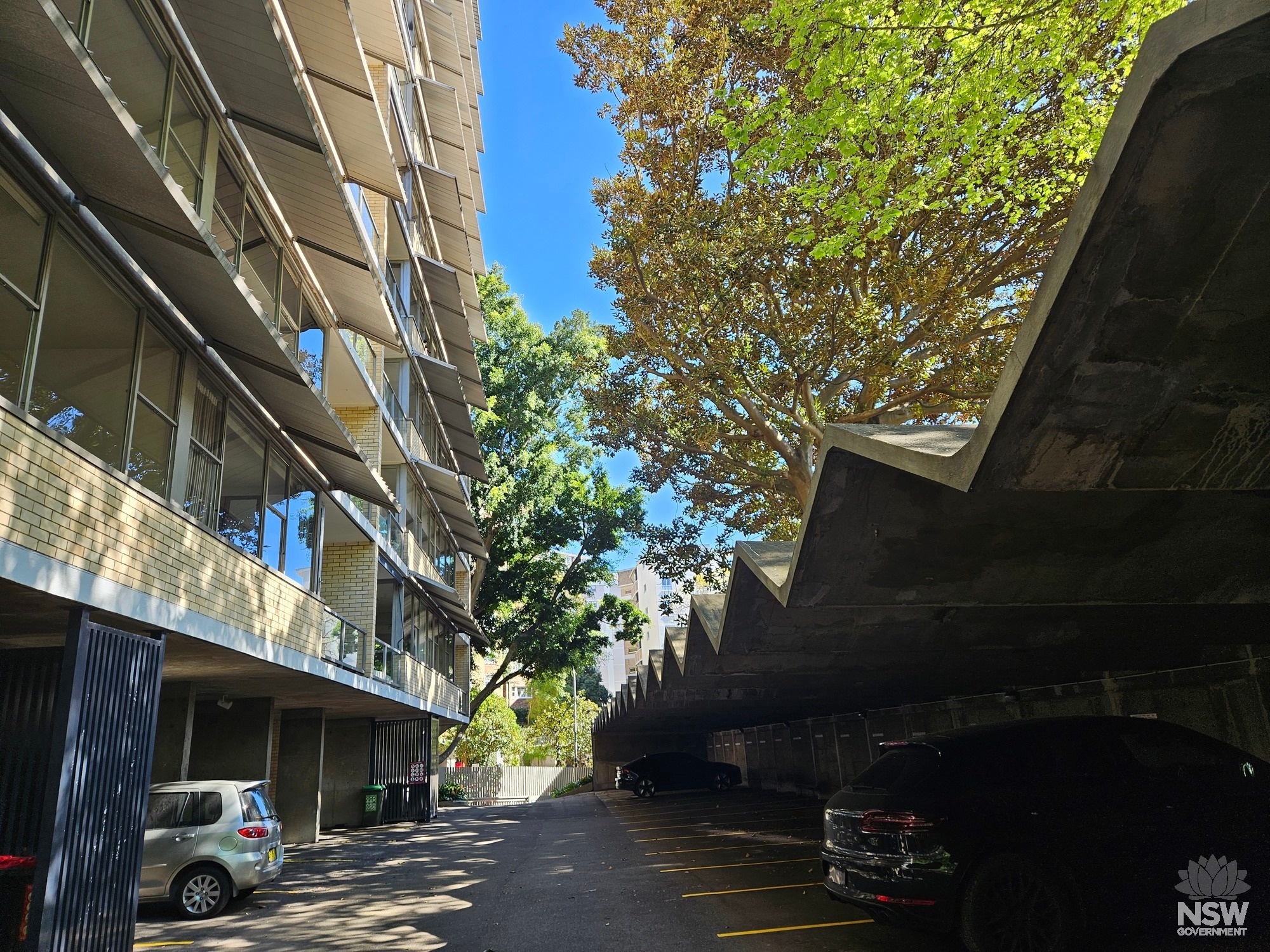 Ithaca Gardens. Apartment building and garage structure.