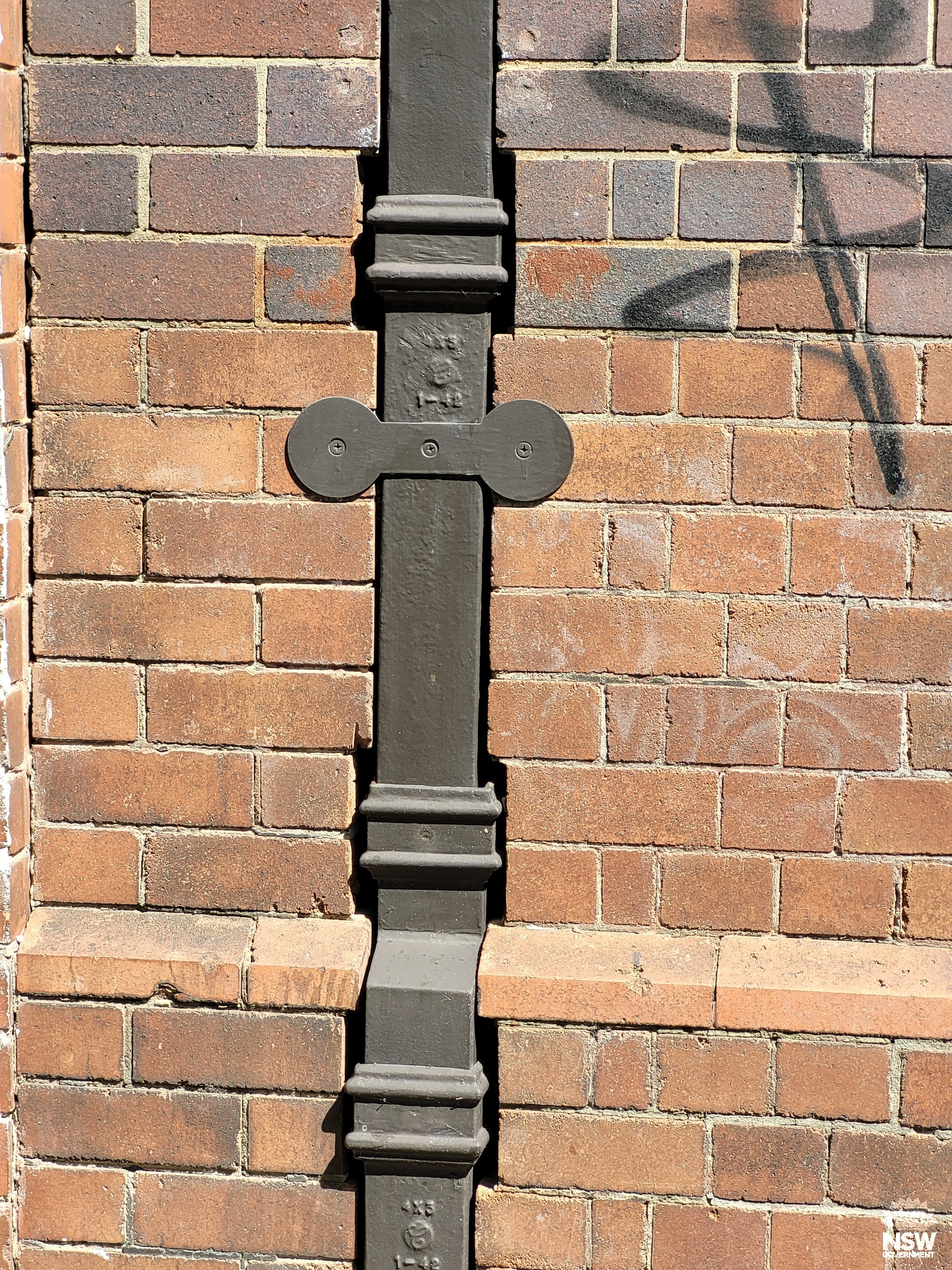 Rainwater downpipe on front wall